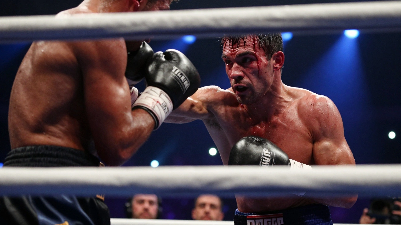 A bloodied boxer in the final round, standing strong against an opponent, crowd blurred in background.
